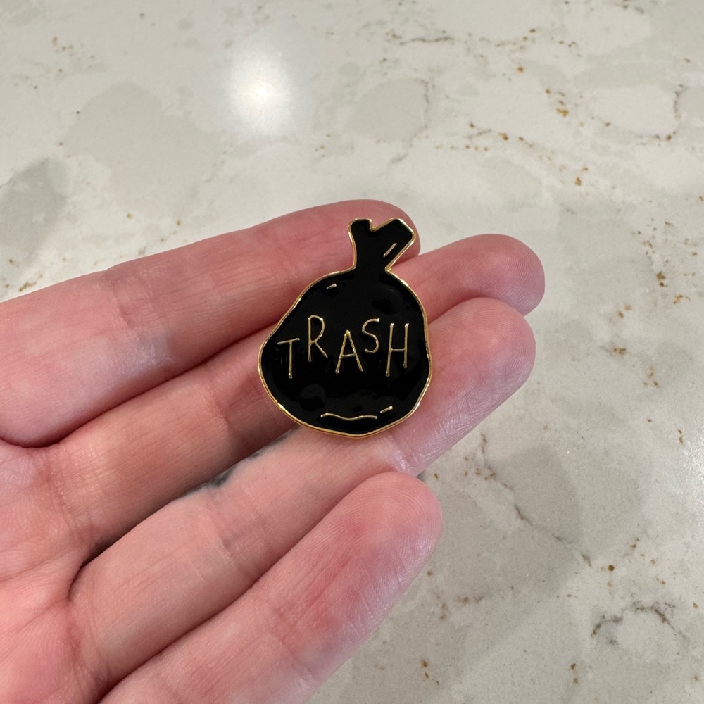 Black and‎ Gold Trash Bag ‘Trash’ Enamel Pin